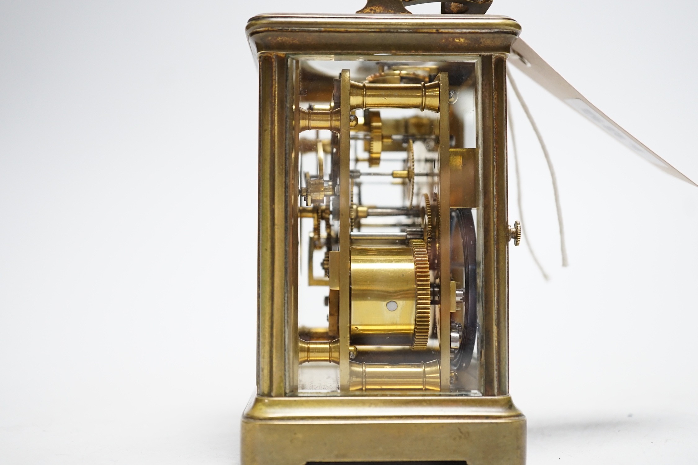 A striking carriage clock, 12cm tall